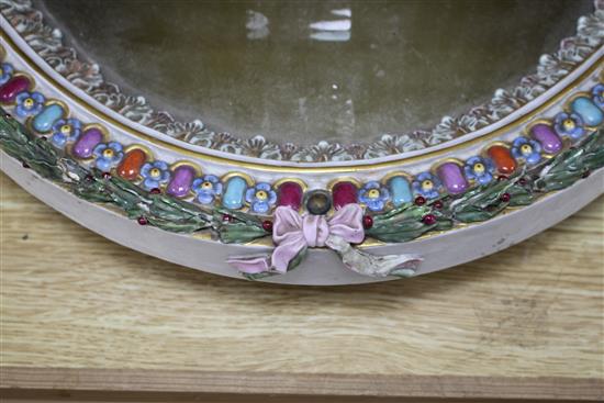 A Meissen porcelain dressing table mirror, surmounted with cherubs (a.f.), overall height 56cm